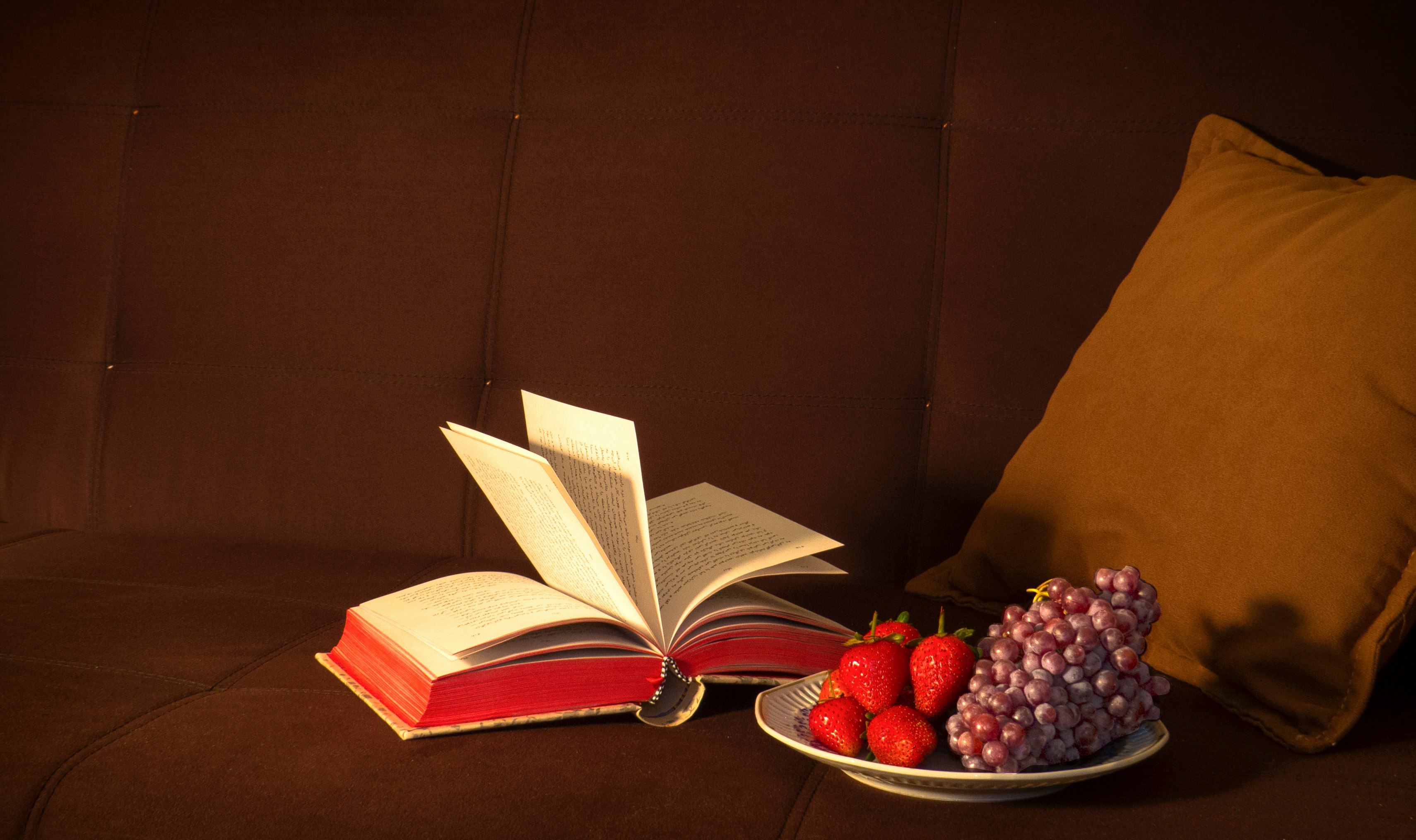 strawberries and grapes on white plate